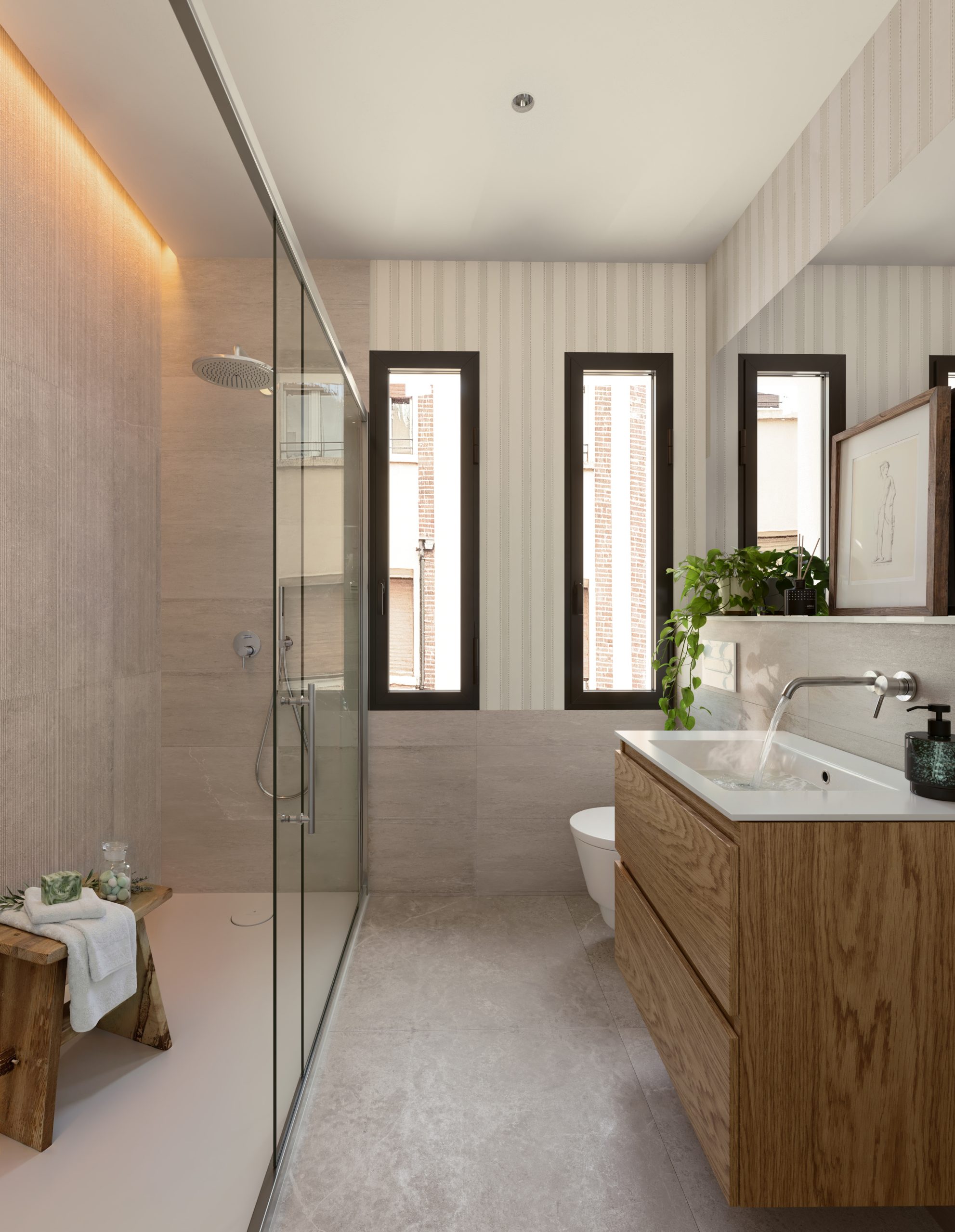 Baño contemporáneo con revestimientos de gran formato, sanitarios suspendidos e iluminación integrada en Calle Manifestación 1-3, Zaragoza
